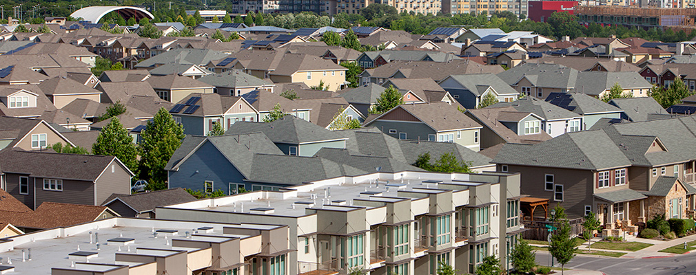 An aerial view of houses in a residential neighborhood.