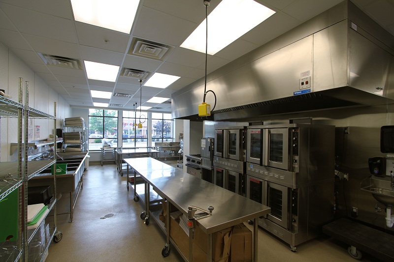 The commercial kitchen, which employs many Veterans Manor residents, provides between 3,000 and 5,000 meals each day to local schools and low-income residents in the neighborhood.