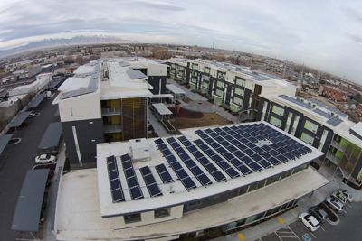 Photograph of solar panel arrays on the roofs of the buildings in the Bud Bailey Apartment Community.