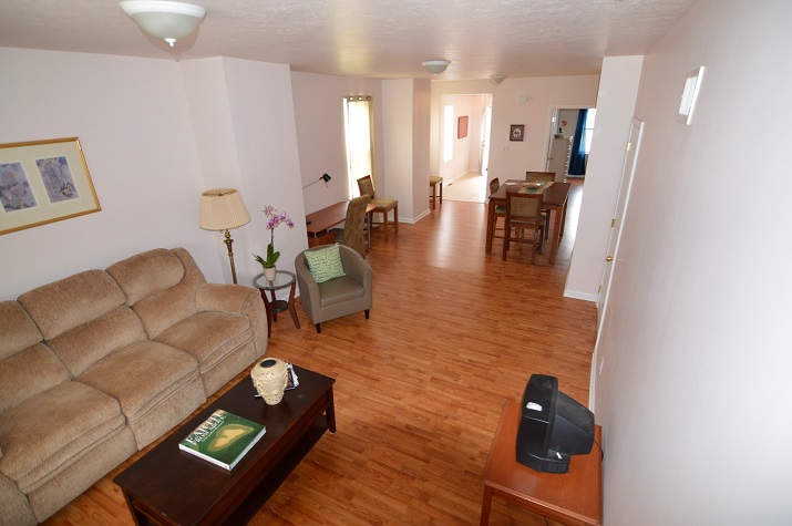Photograph of the living and dining rooms in one of the units in the Millvale building.