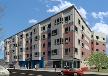  A rendering of Tagliareni Plaza, a five-story building, with a façade that differentiates the first-floor commercial space, lobby, and garage entrance from the residential floors above by means of material, color, and window size and shape — as seen from across the street. 