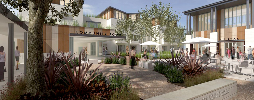 Digitally-rendered image depicting an internal courtyard with a community center, landscaping, and furniture, surrounded by multistory buildings.