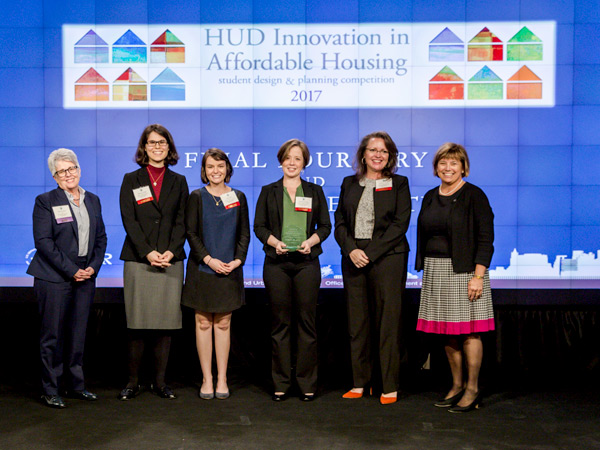 HUD Acting Deputy Secretary Janet Golrick poses with the winners of the 2017 Innovation in Affordable Housing Student Design and Planning Competition.