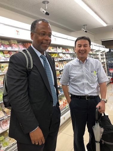 Calvin Johnson and Keiji Kamiyama standing in the aisle of a 7-Eleven store.
