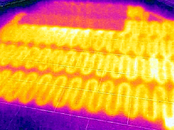 Thermal image of a radiant heating system under a tile floor.