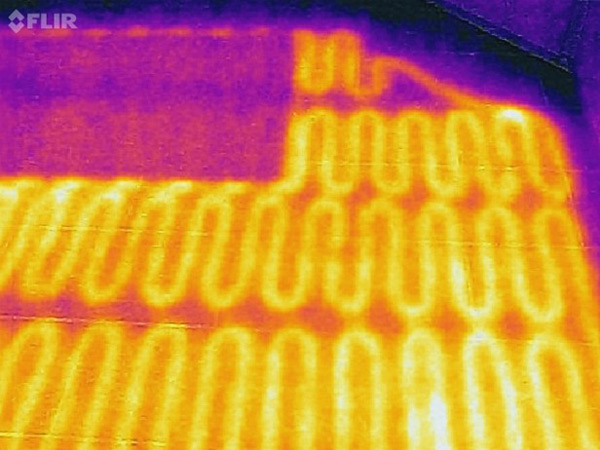 Thermal image of a ceramic floor with electric radiant heating coils visible below.
