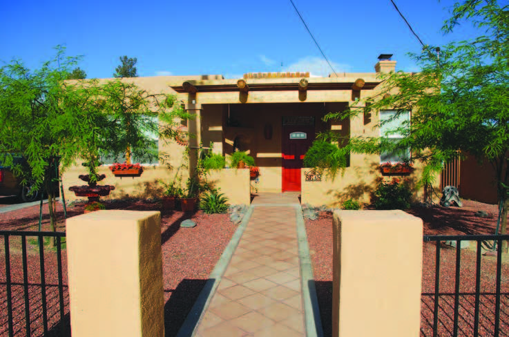 Photo shows front view of the Guadalupe House, which exemplifies sustainable building combined with culturally relevant features.