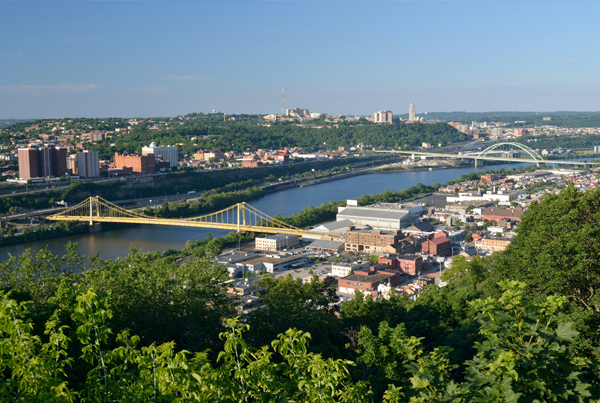 Aerial view of a city on a river with bridges.