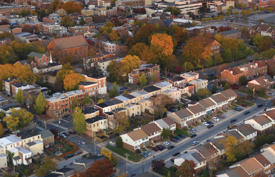 Aerial view of a residential area of Wilmington, Delaware with commercial buildings in the background. Aerial view of a residential area of Wilmington, Delaware with commercial buildings in the background.