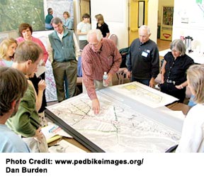 A group of people collaborating on how to provide supportive services to aging residents of a neighborhood.