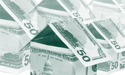 A picture of houses made of dollar bills.