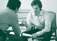 A picture of two men in discussion.