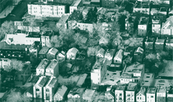 An aerial view of a small industrial city.