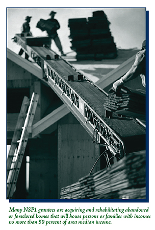 Construction workers at work rehabilitating an abandoned/foreclosed home.