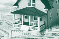 An image of a house over dollar bills.