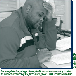 A picture of a foreclosure counselor advising a borrower.