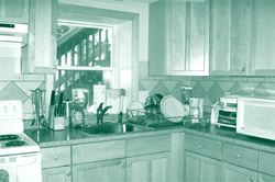 A picture of a kitchen in an ADU that provides secondary living quarters on a single-family lot.