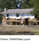 A picture of an abandoned home in severe disrepair.