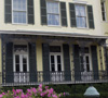 House with shuttered windows.