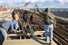 Workers constructing boardwalk.