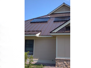 Solar domestic hot water on Sunrise Acres unit roof.