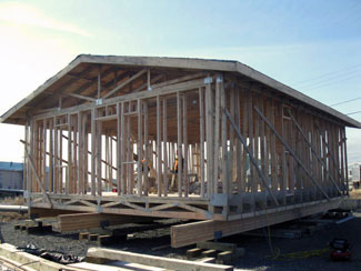 The integrated truss includes roof, walls, and floor.