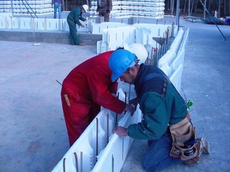 Image of workers constructing the reinforced ICF walls.