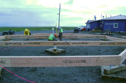 Materials spread out for construction of the octagon houses.