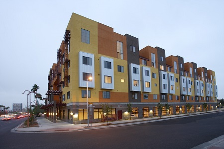 Image of Devine Legacy, a 65 unit, mixed income, transit-oriented and LEED Platinum housing development strategically located for residents to gain access to work and school, with a light rail station  half a block away, and downtown less than 3 miles to the south.