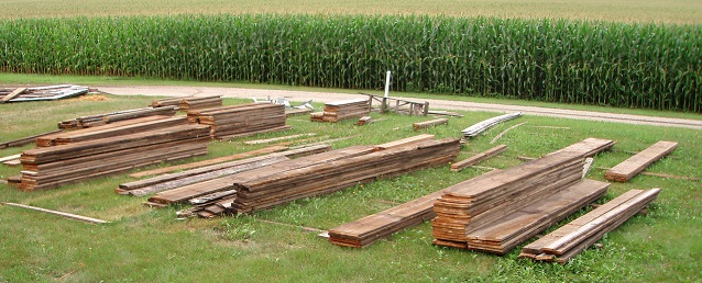 Assorted wood materials that were salvaged from a wooden structure that was deconstructed.