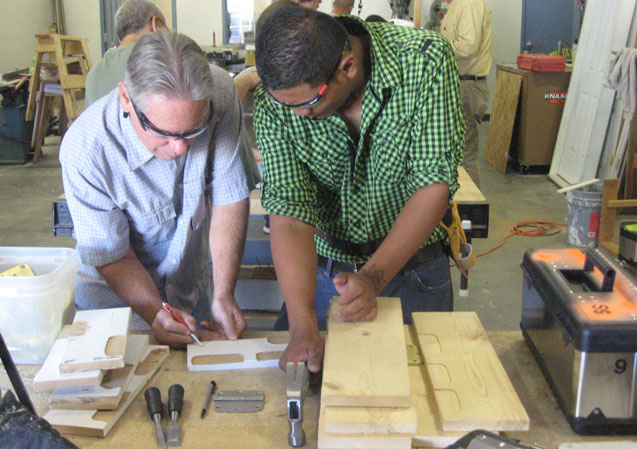 Image of instructor demonstrating proper layout and prepping material to mortise hinges.