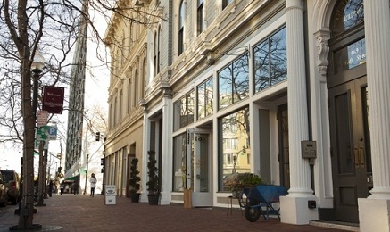 Sidewalk and building facades depicting a popuphood