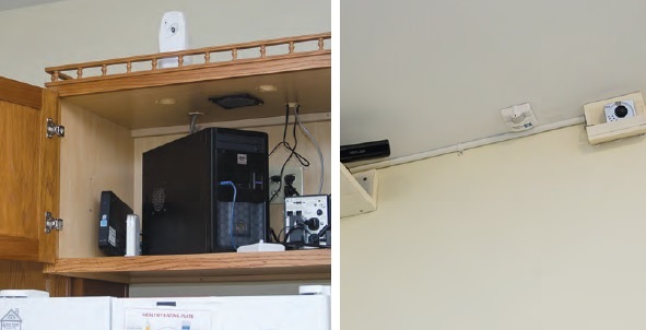 Electronic sensor equipment mounted on a wall and in a cupboard of an elder’s home.