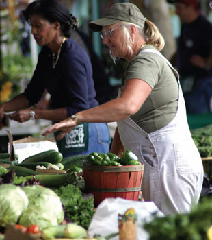 Image of Pedestrian-friendly neighborhoods with accessible farmers markets, shops, and parks help reduce a community’s carbon footprint