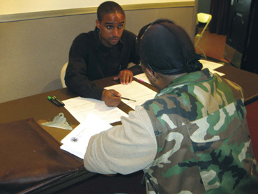 A homeless veteran is interviewed for a HUD-VASH voucher.