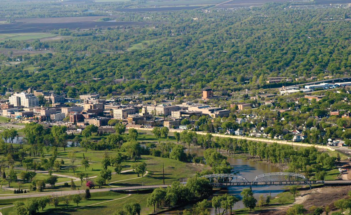 The centerpiece of Grand Forks’ new flood protection system is the Greenway, parkland between the river and the new dike system that can be safely flooded during periods of
high water and used as recreation space at other times.