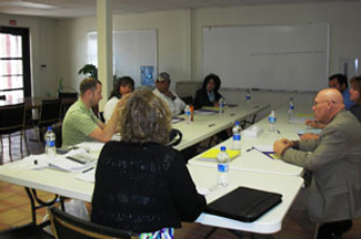 CIHAD staff members meet with the SCinIC technical team.