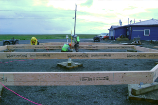 Materials spread out for construction of the octagon houses.