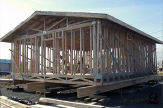 The integrated truss includes roof, walls, and floor.