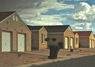 These houses are typical clustered housing development on the Navajo Nation.