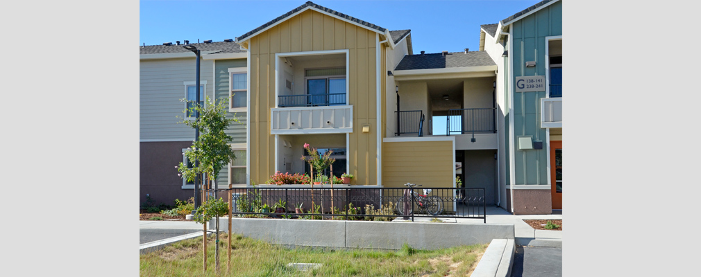 Photograph of a two-story apartment building.