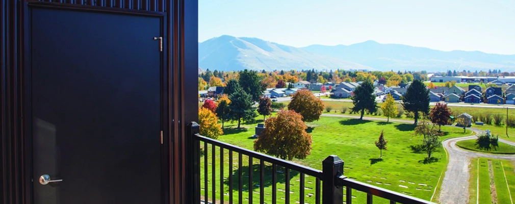 Mountains in the distance and open space in the foreground viewed from an upper story of the Villagio.