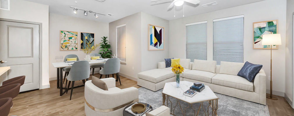 An open-concept apartment living room and dining area.