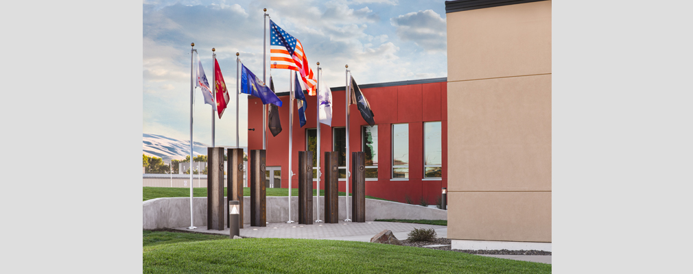 Photograph of veterans' memorial with flags representing the branches of the U.S. Armed Forces