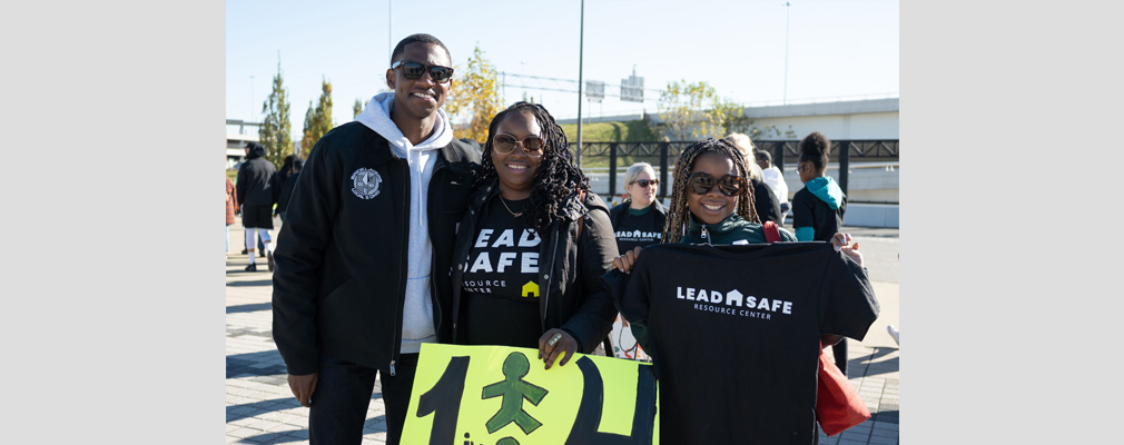 Posed photograph of three smiling people representing the Lead Safe Resource Center.