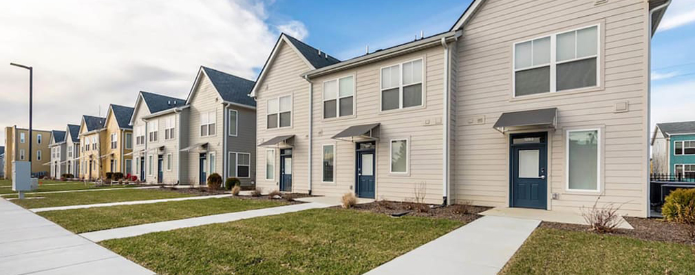 Photograph of a row of two-story townhomes.