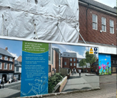 Two-story building in the process of being renovated.