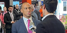 A man holds a microphone up to HUD Secretary Scott Turner at the 2025 International Builders' Show.