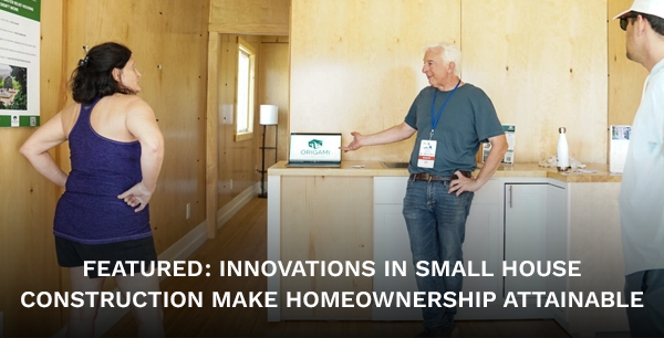 A group of people inside a model house.