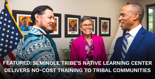 HUD Secretary Scott Turner shakes hands with a representative of the Seminole tribe at the Native Learning Center
